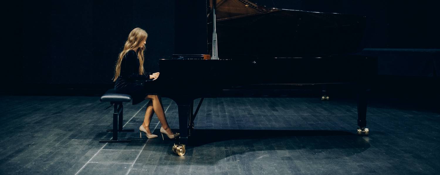 person playing a piano solo on stage