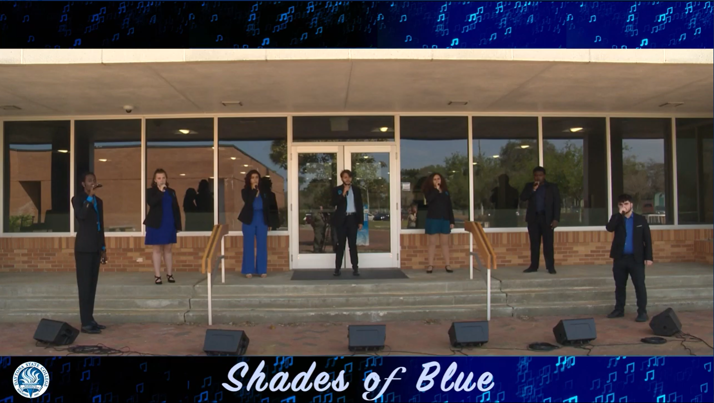 seven student singing at Shades of Blue concert