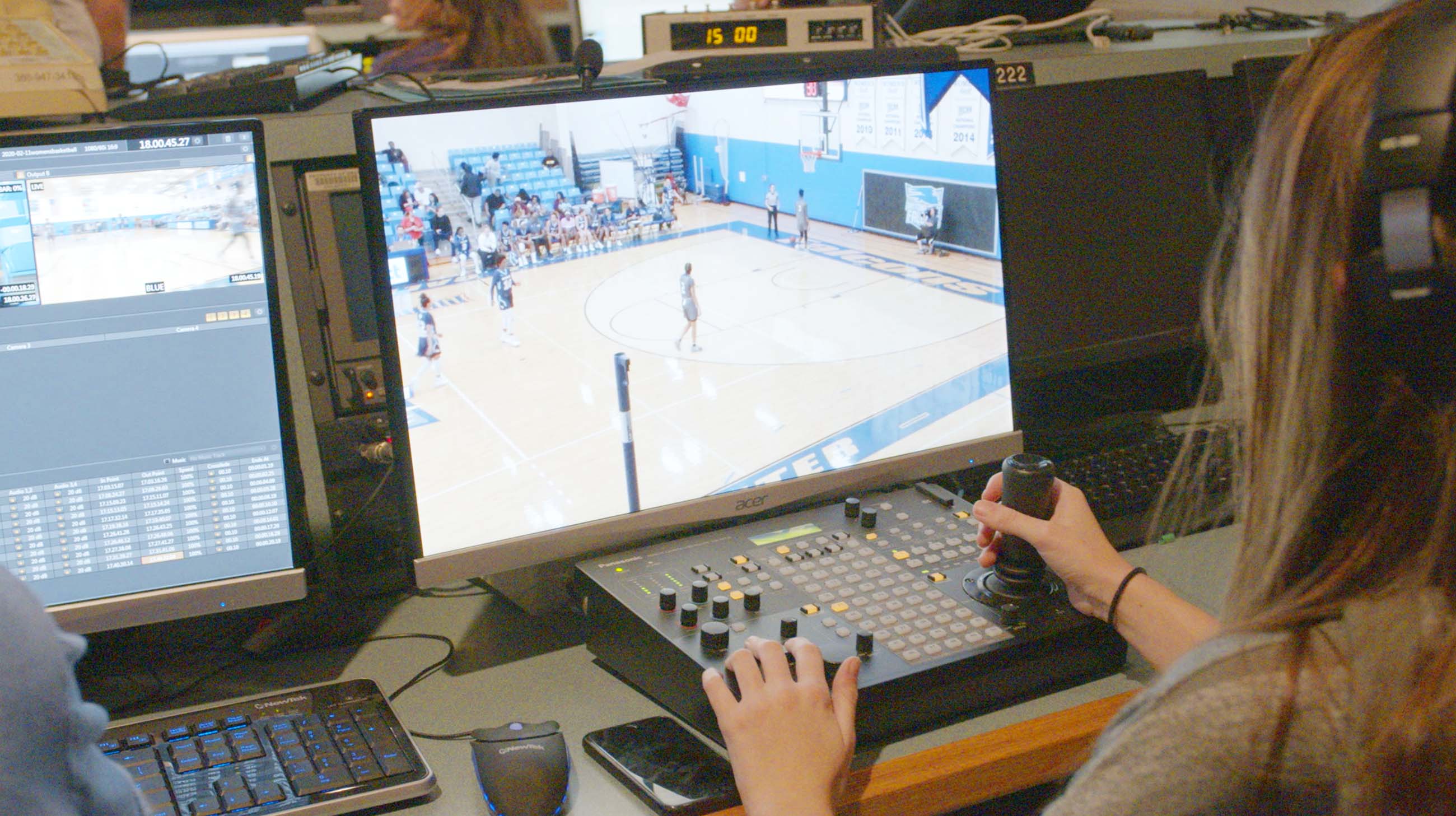 Student remotely operating a TV production camera during broadcast.