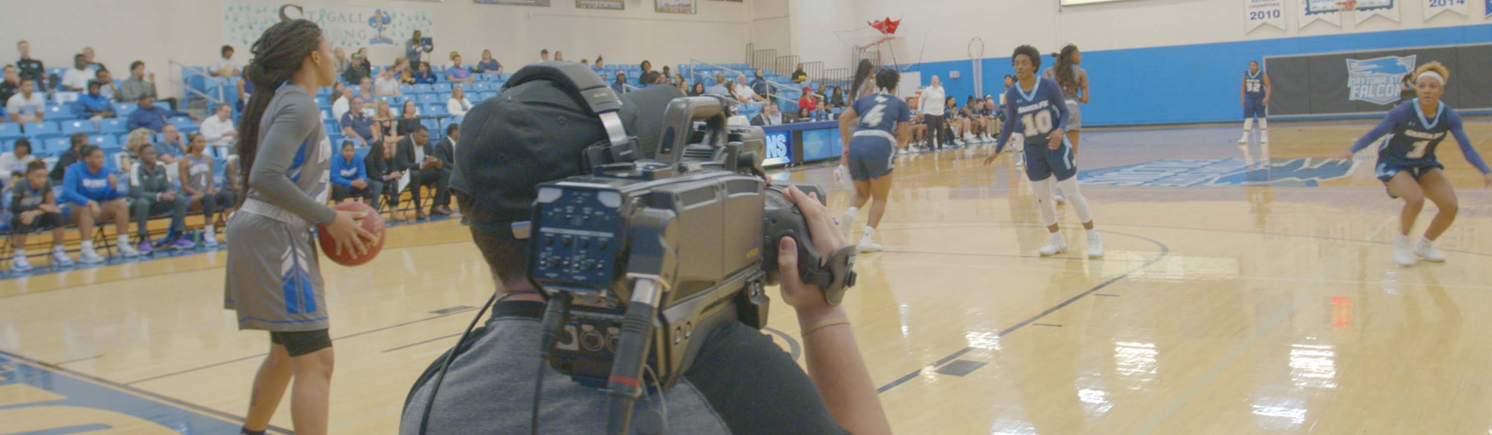 Student on camera recording a production.