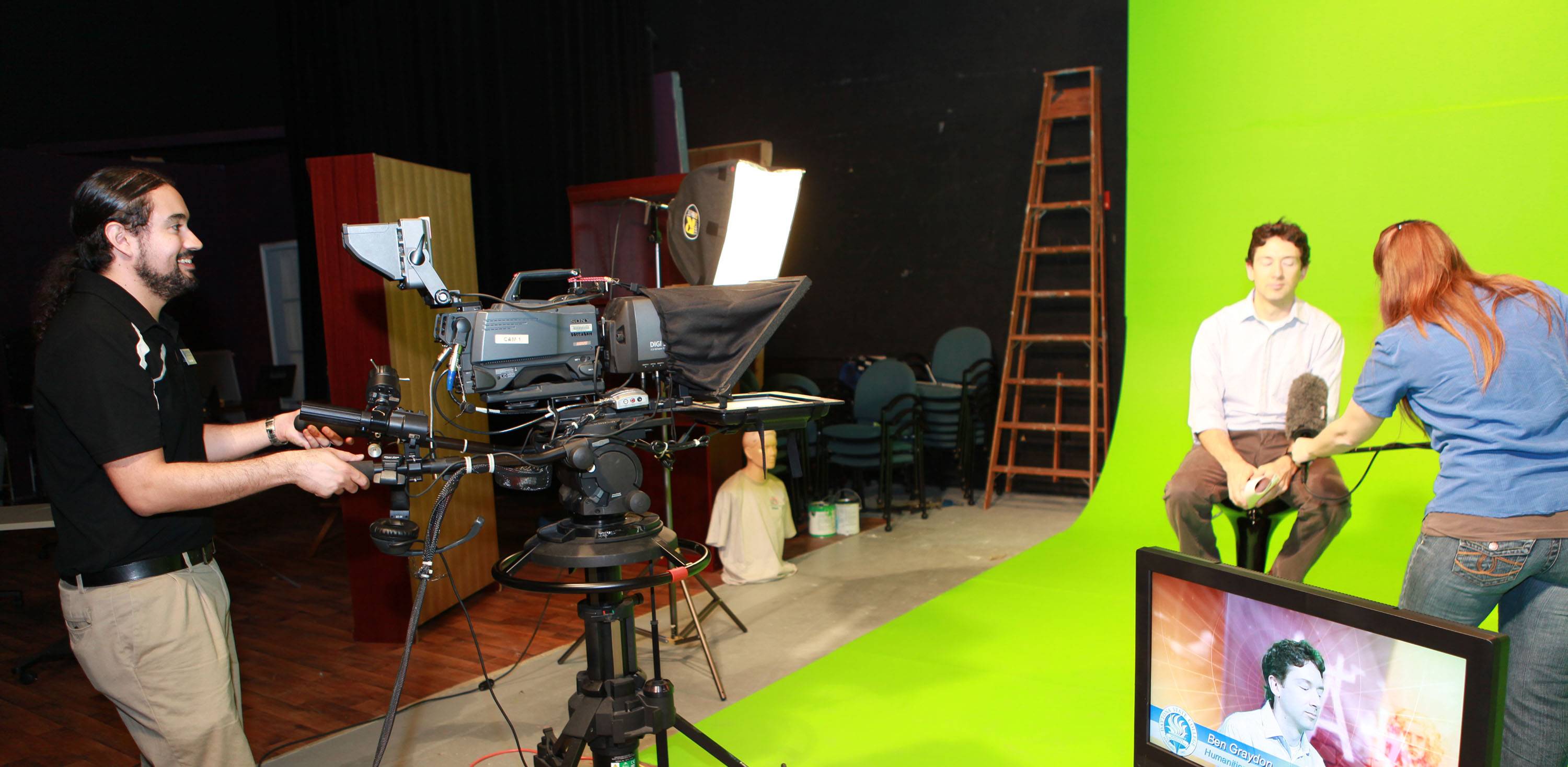 Students working on a video production set. 