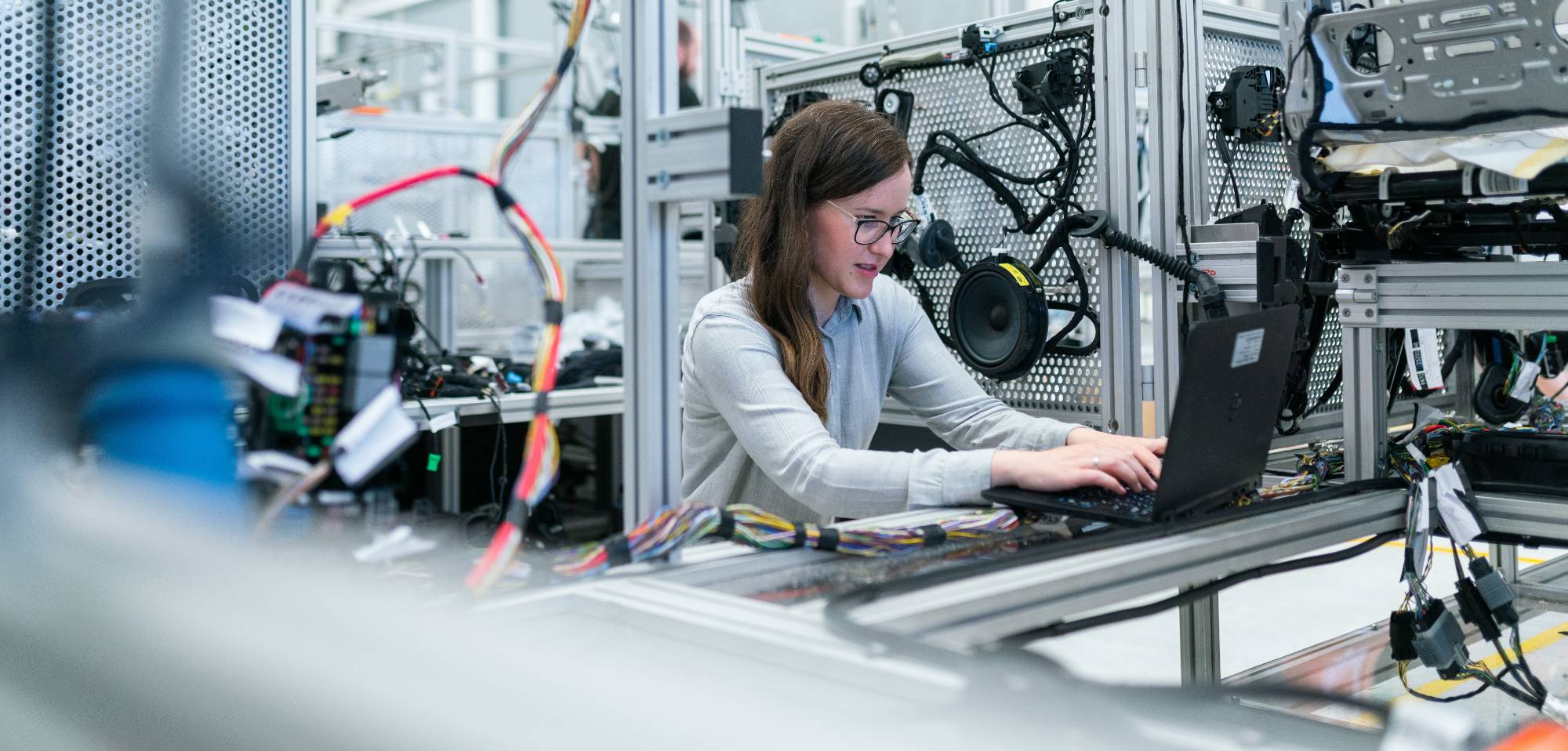 engineer working on a computer in an electronics room