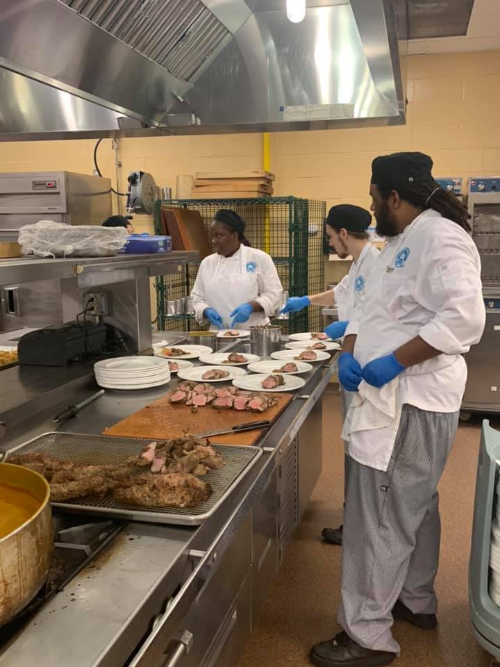 students cooking in a culinary class
