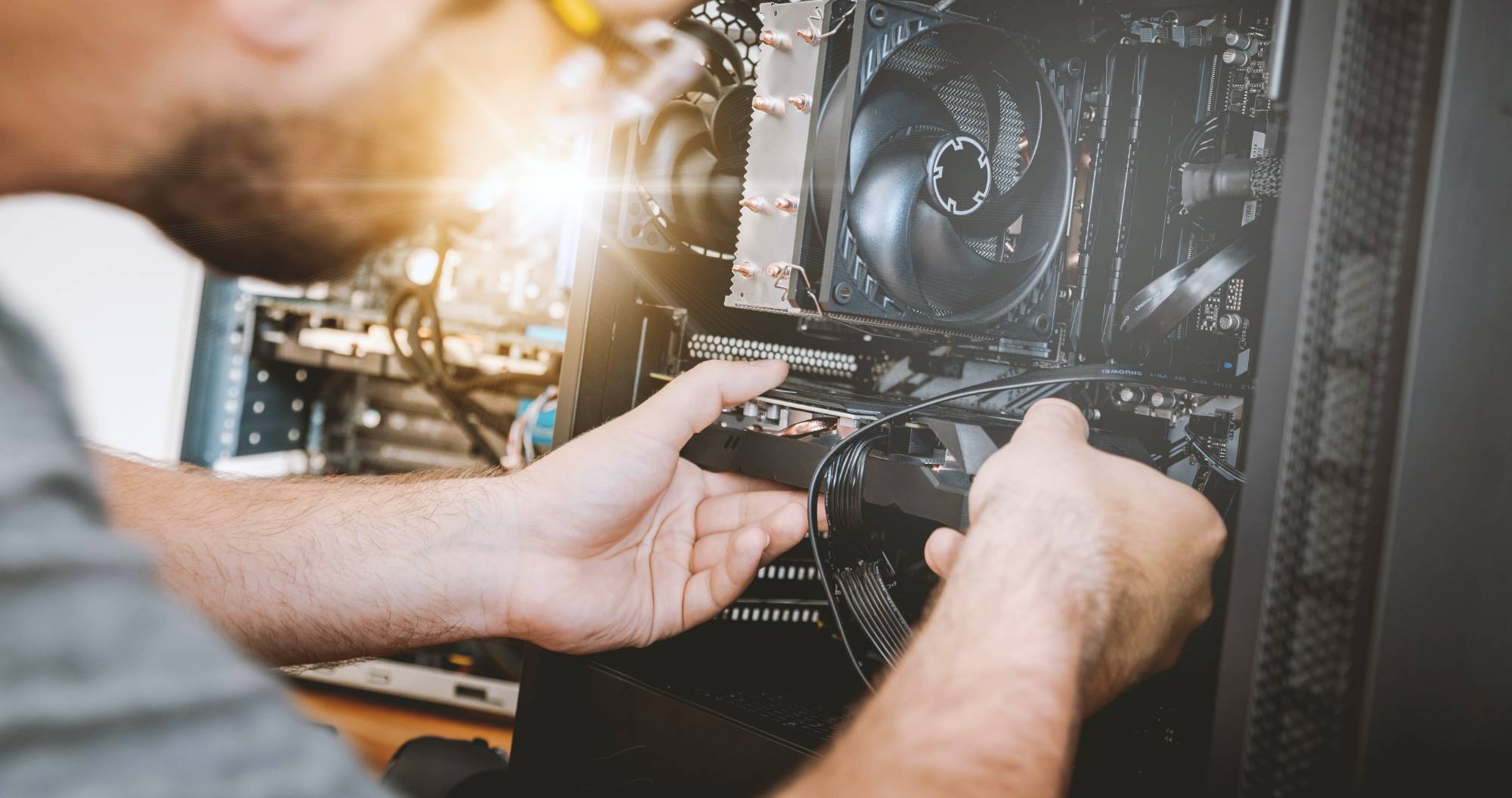 person repairing computer hardware