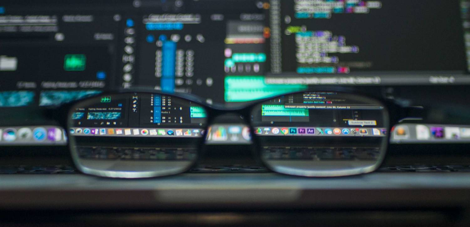 glasses in front of a computer