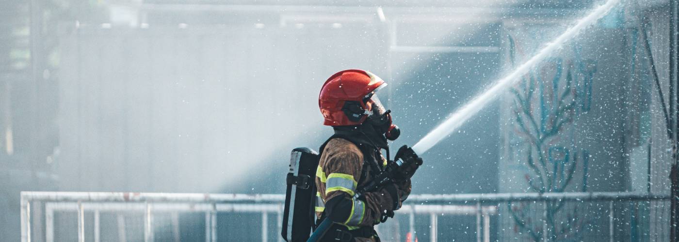 fire fighter with hose