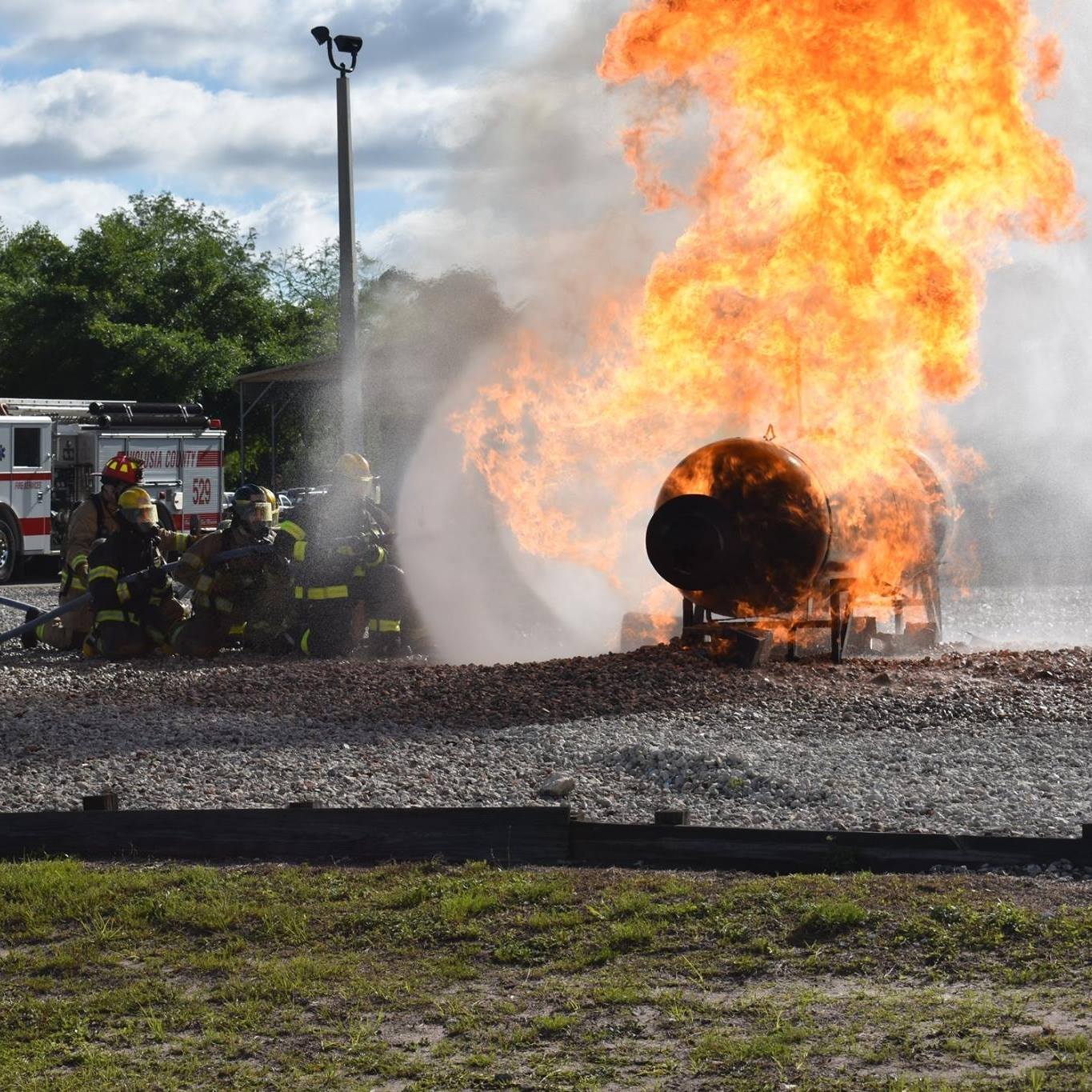 firefighters training putting out a fire