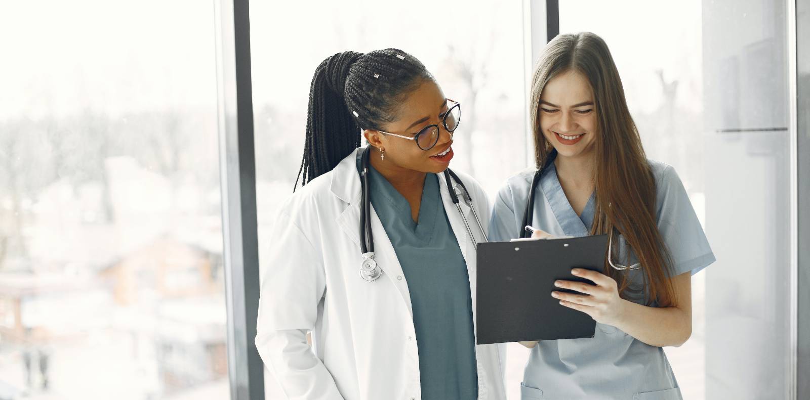 two heathcare workers reviewing paperwork