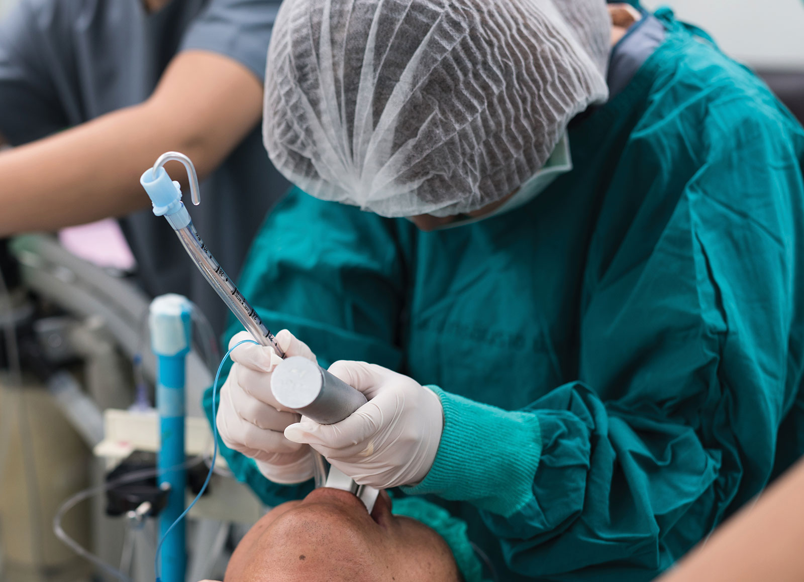 anesthesiologist working over a patient