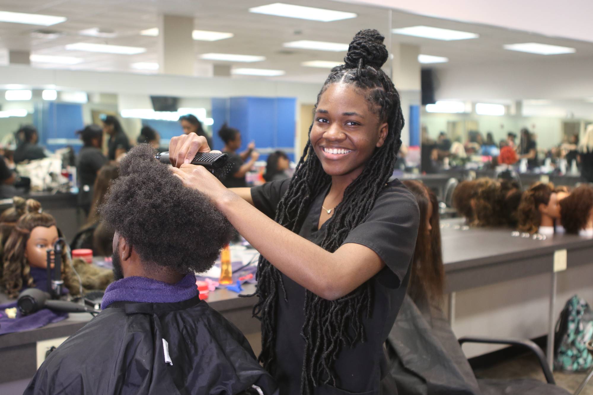 Cosmo student doing hair