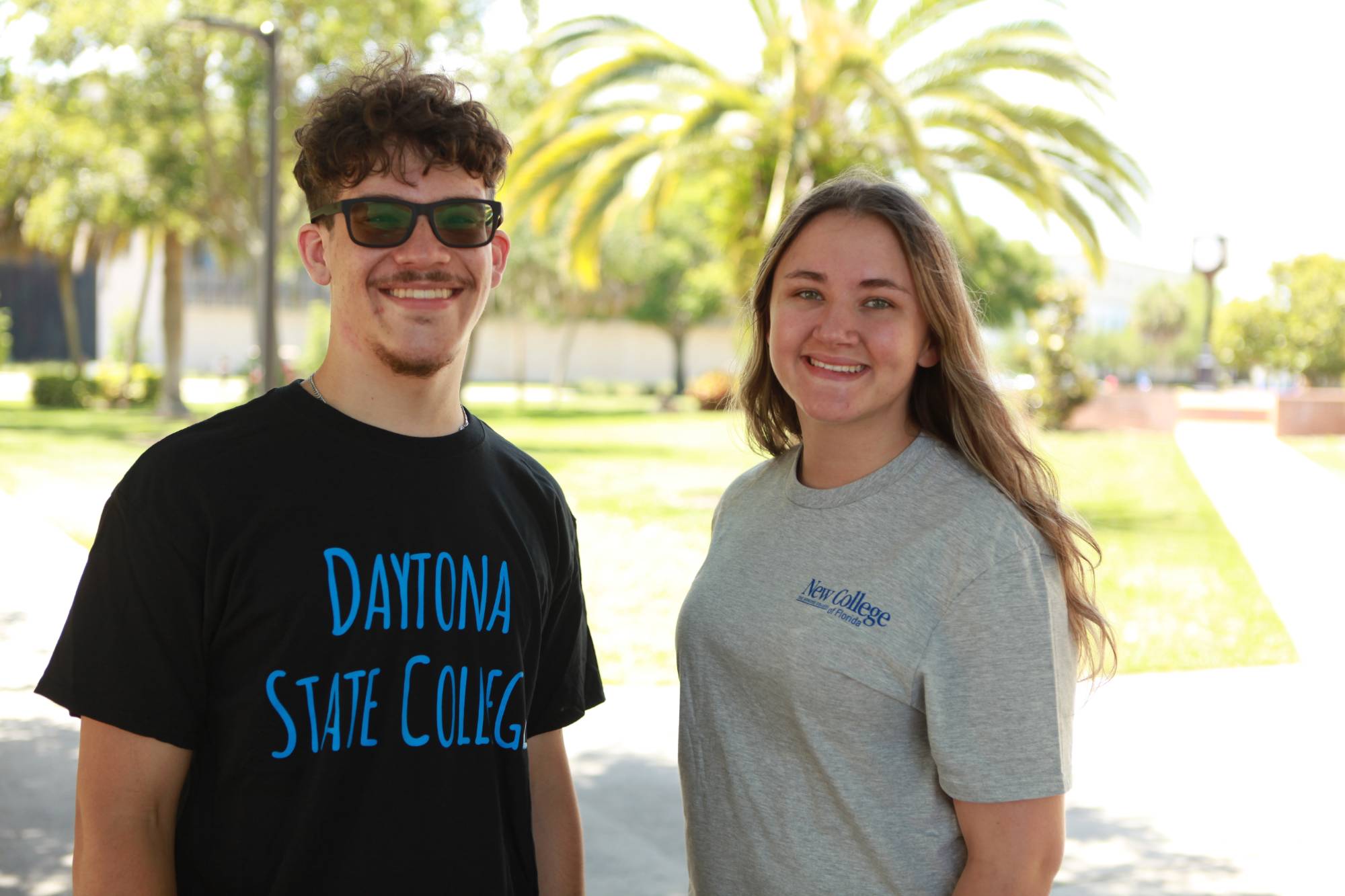 student in Daytona State College tshirt and another student in New College tshirt
