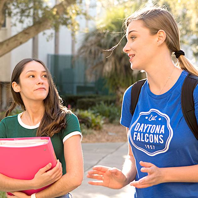 student outside giving a tour to a prospect