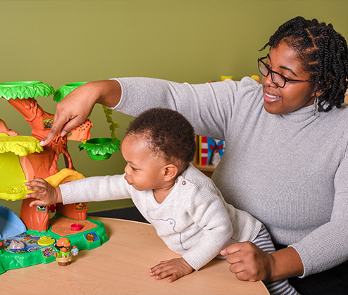 Deja and child playing