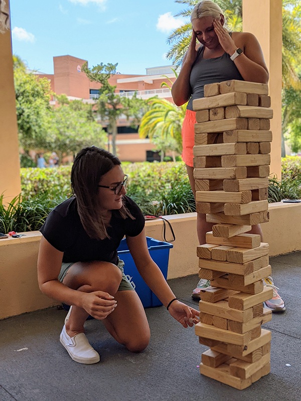 female students playing jinga
