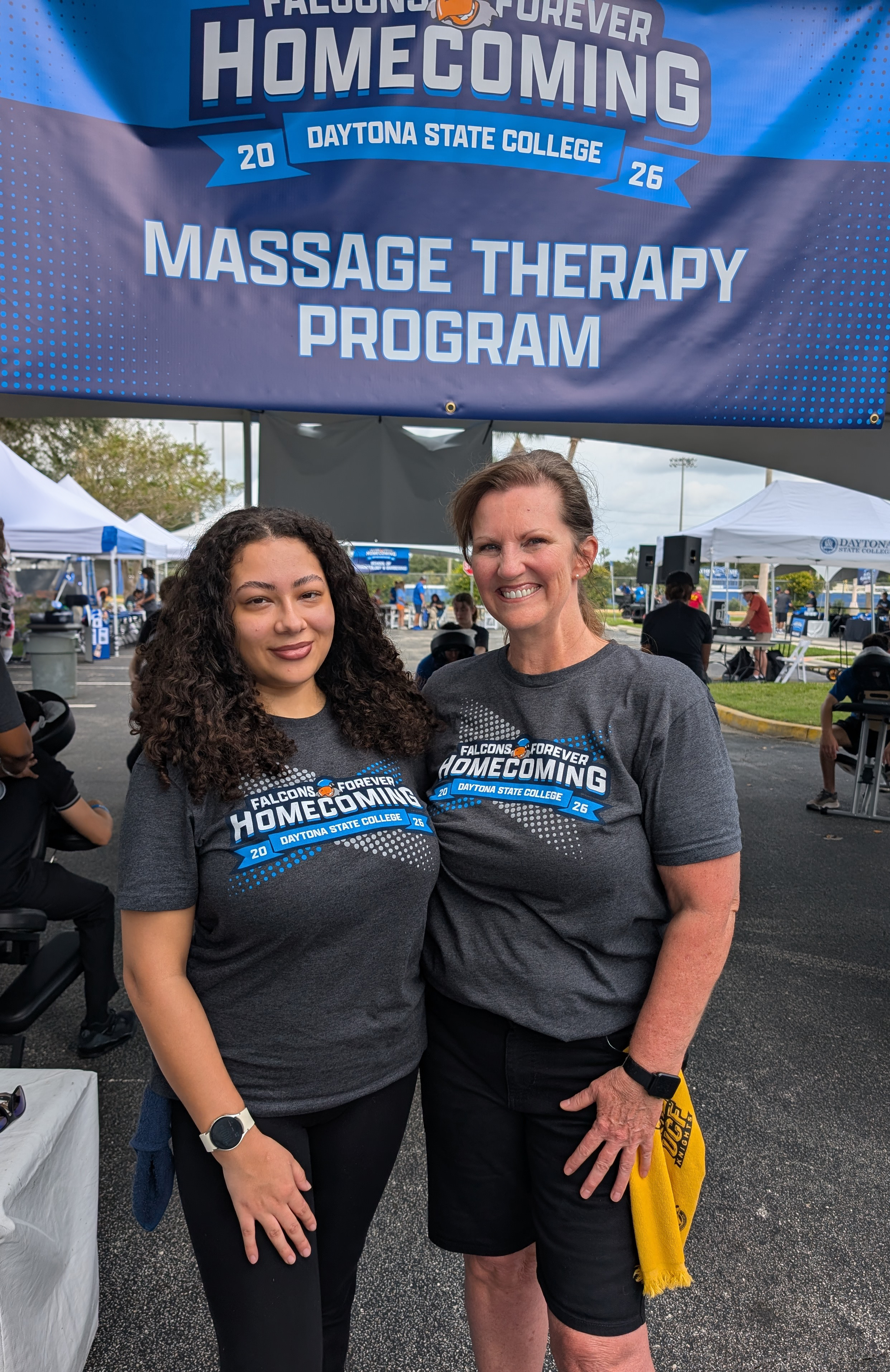 Two Massage Therapy Program students at Homecoming. 