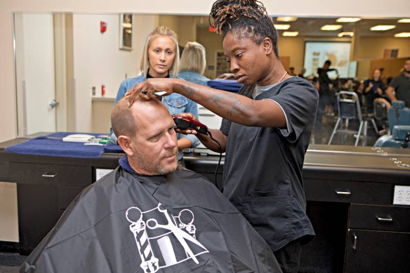 barbering student with client