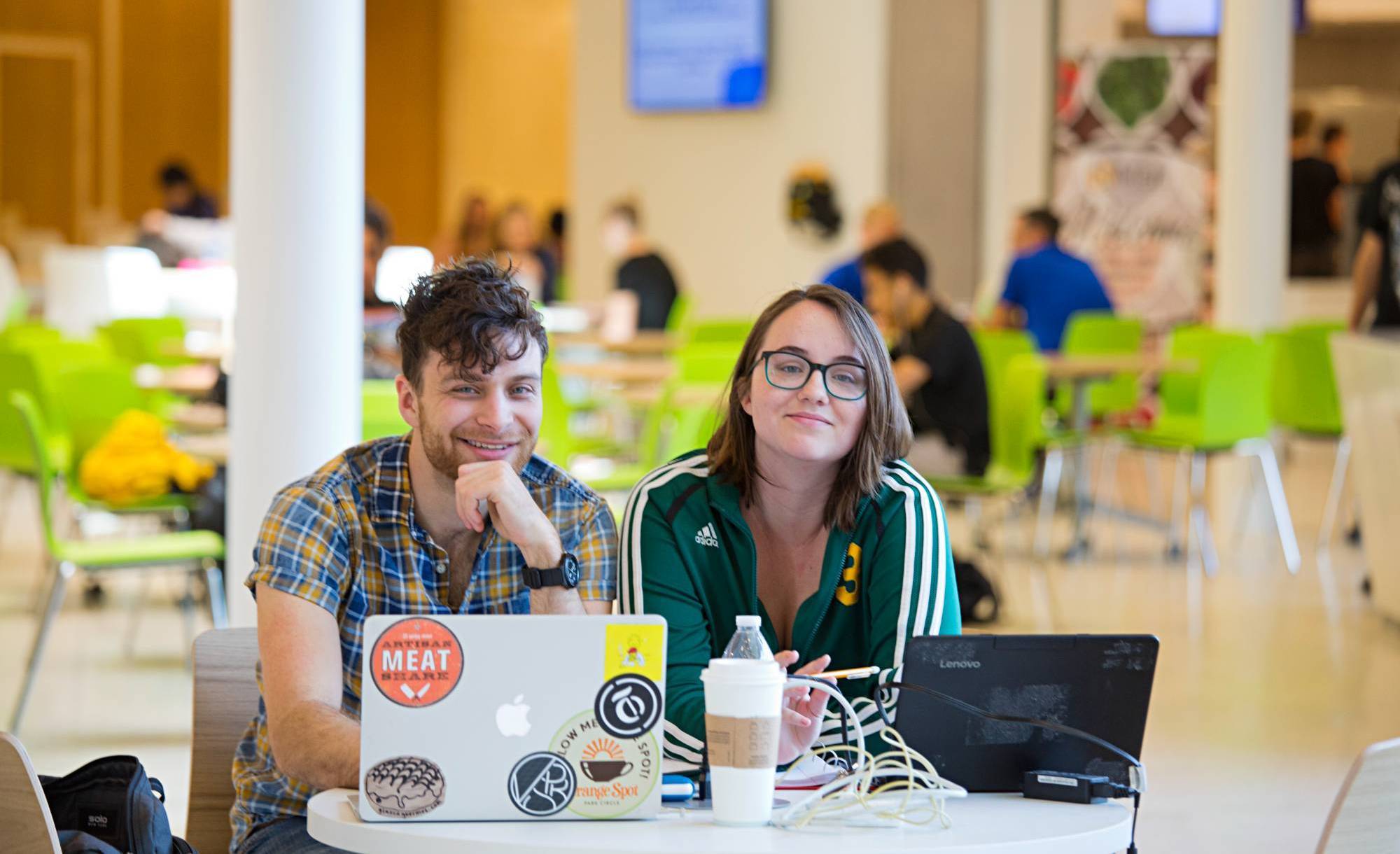 two students at a table in the Student Center