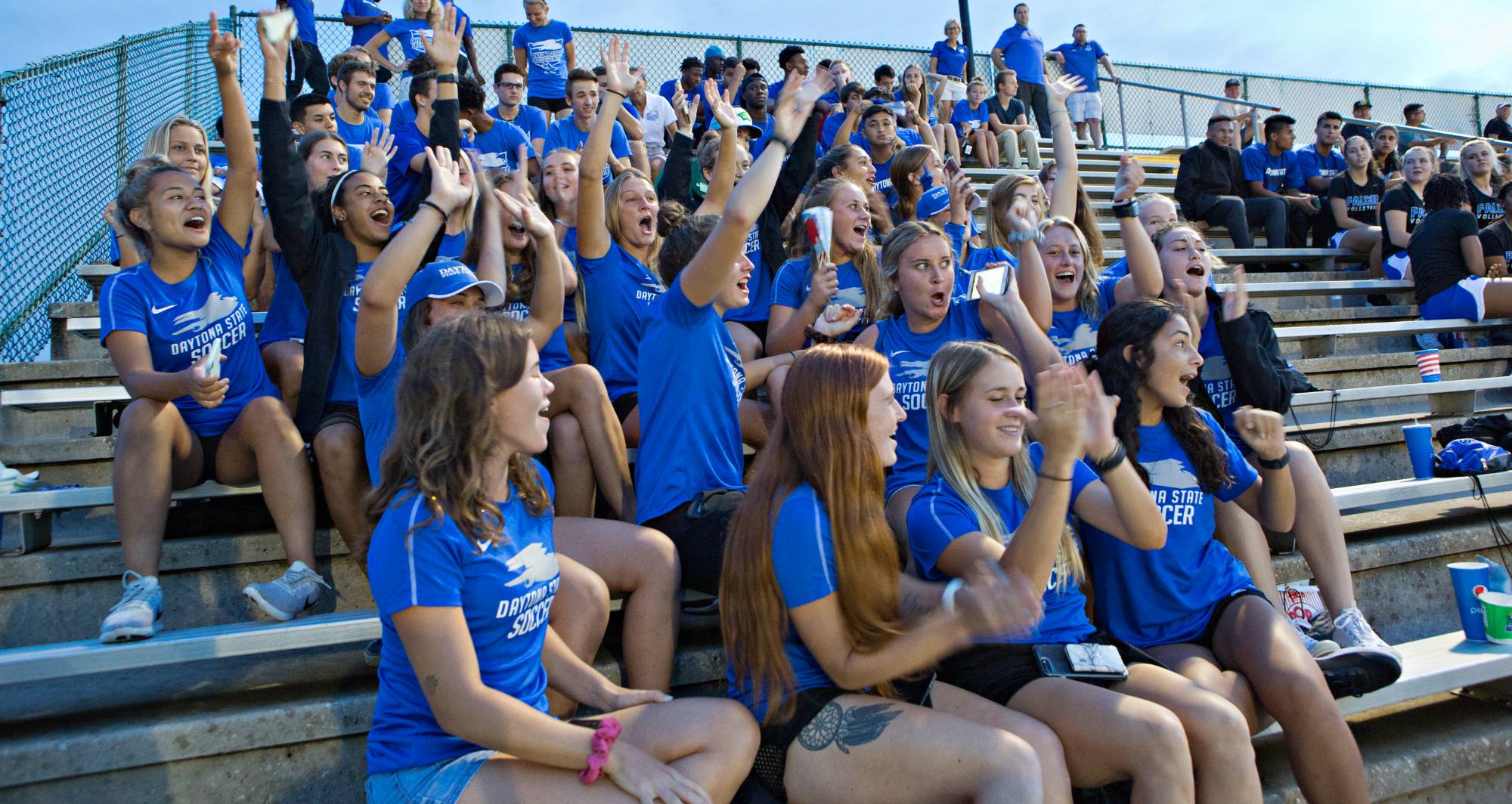 athletes in the stands at the soccer stadium