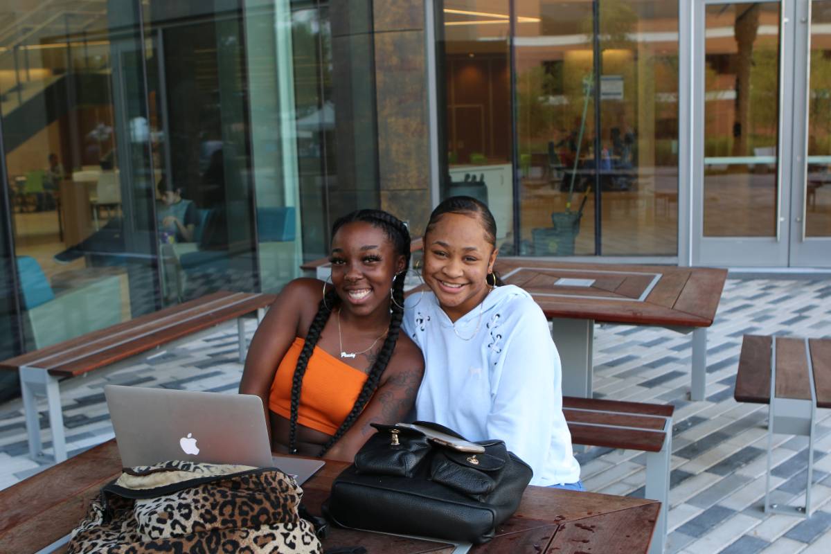 students sitting outside the Student Center