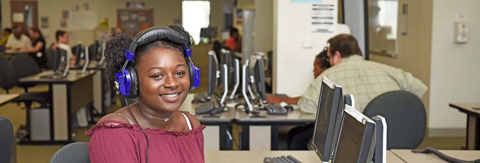 student in Academic Support Center working on a computer