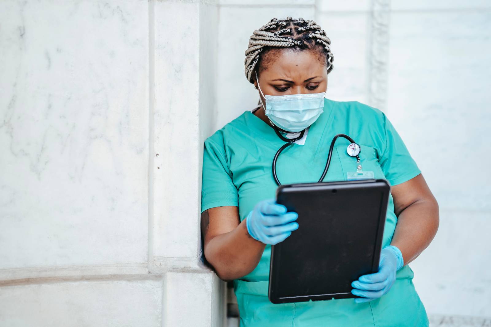 focused nurse with documents in hospital