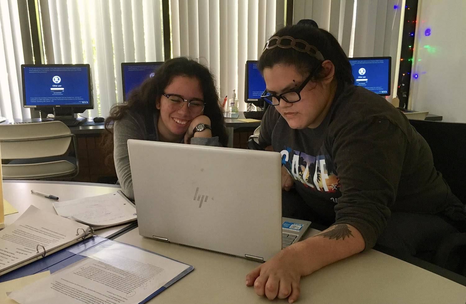 student with a tutor during writing session