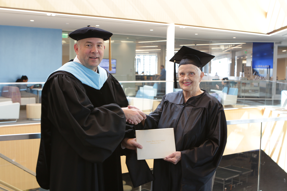 image of Dr. Thomas LoBasso presented diploma to 1960 Graduate Dolly LaNell DeLoach