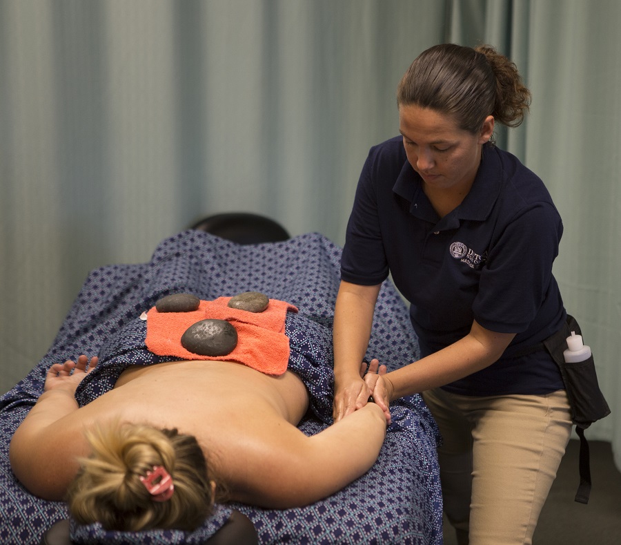 images of massage therapy student performing a massage on a client