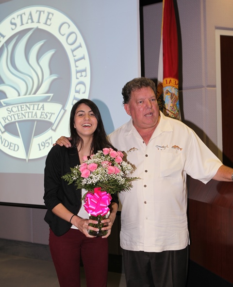 Melissa Diaz was surprised by the scholarship announcement, joined by her stepfather Mark Tomlinson (shown here), mother Brigitte Tomlinson, sister Vanessa Diaz, digitally by her brother Alfredo Diaz, and many student friends and staff.