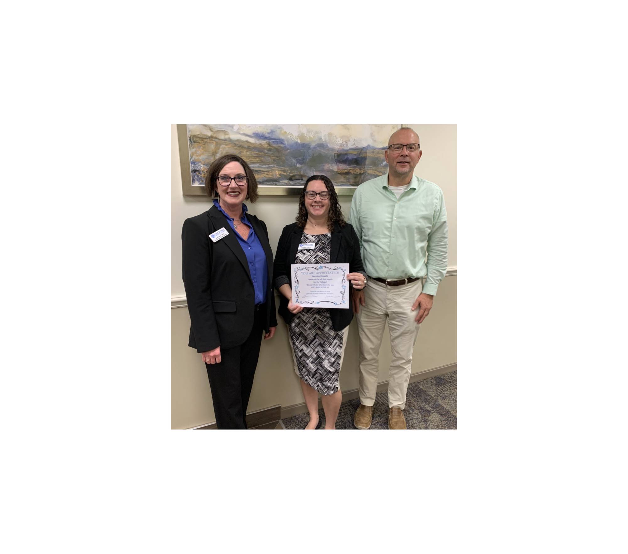 Outstanding employee Jasmine Checchi and administrators. 