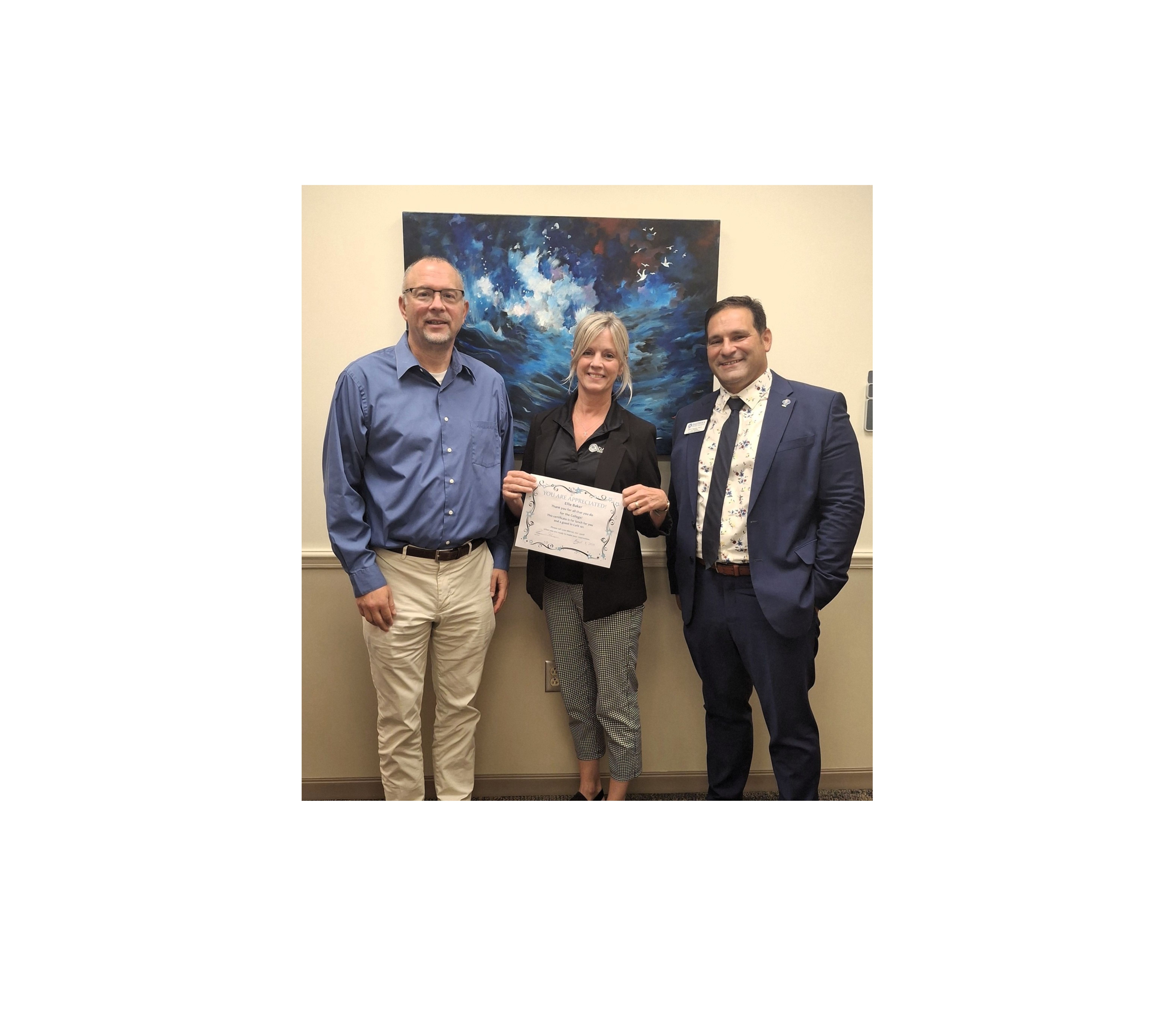 Outstanding employee Ellie Baker and administrators. 