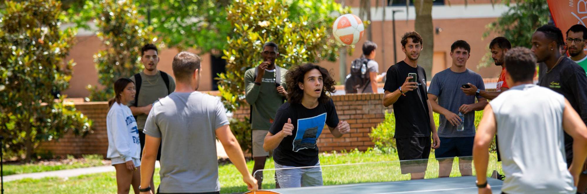 Students playing teqball