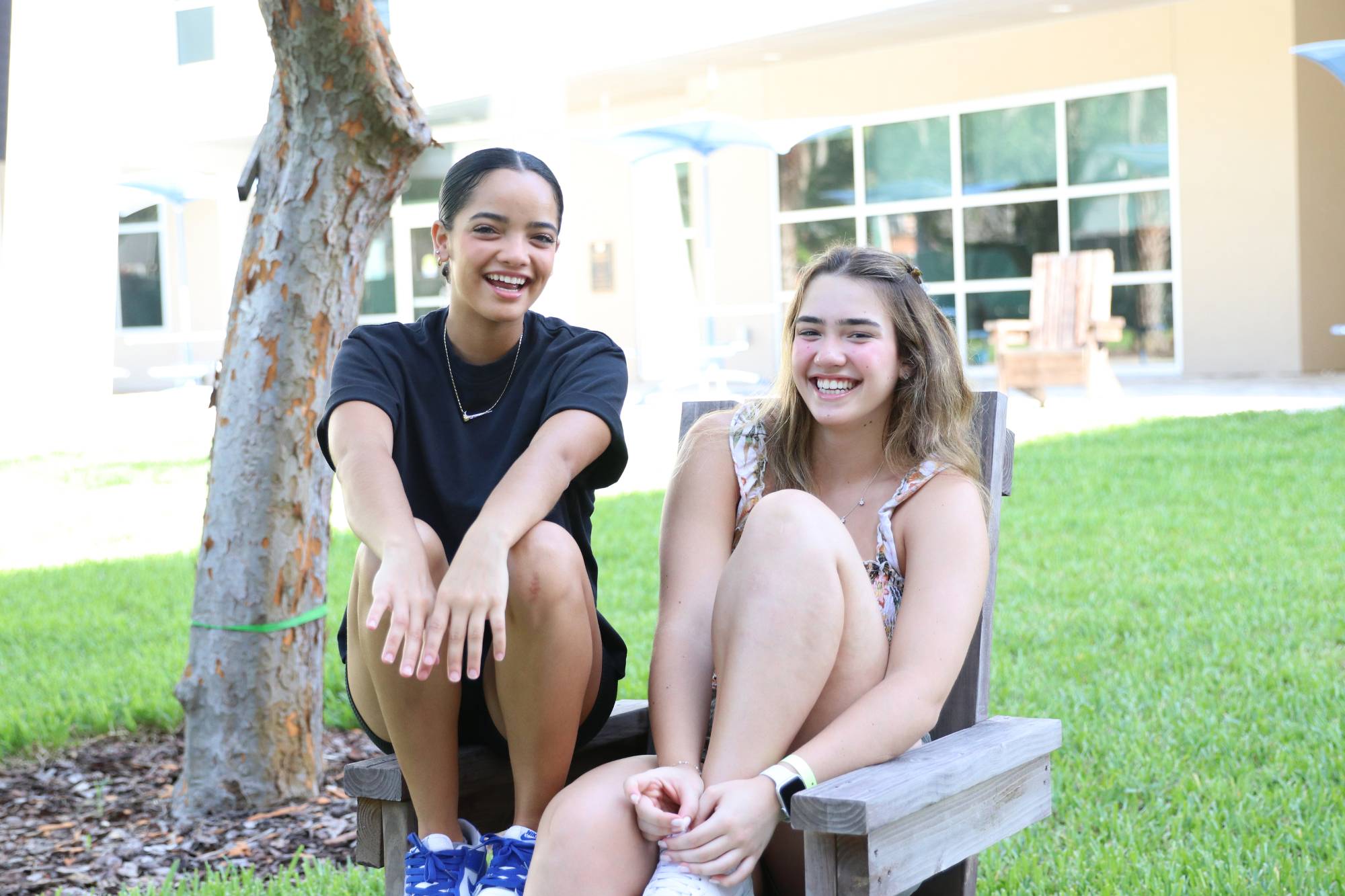 Students relaxing outside the dorm