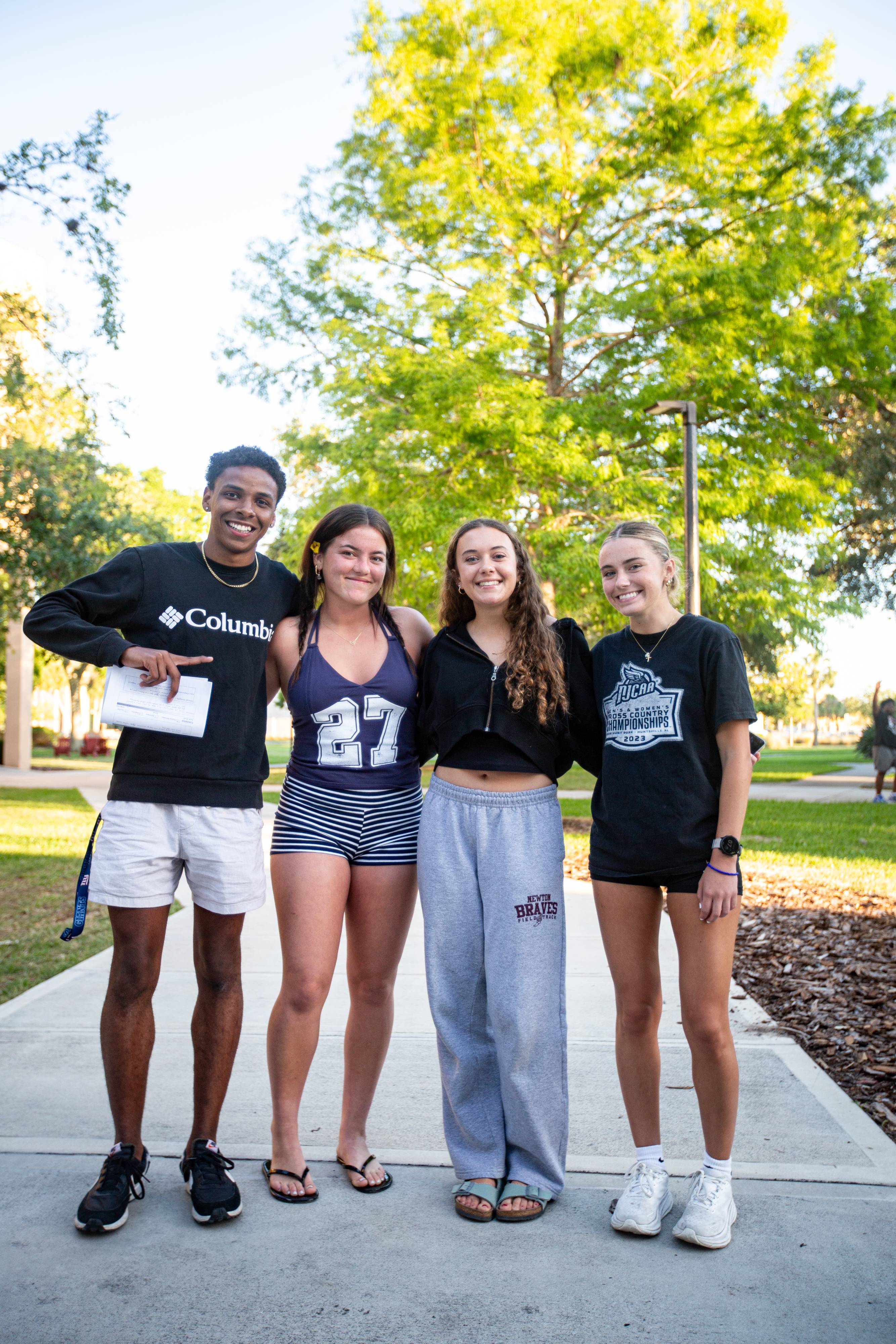 Students relaxing outside the dorm