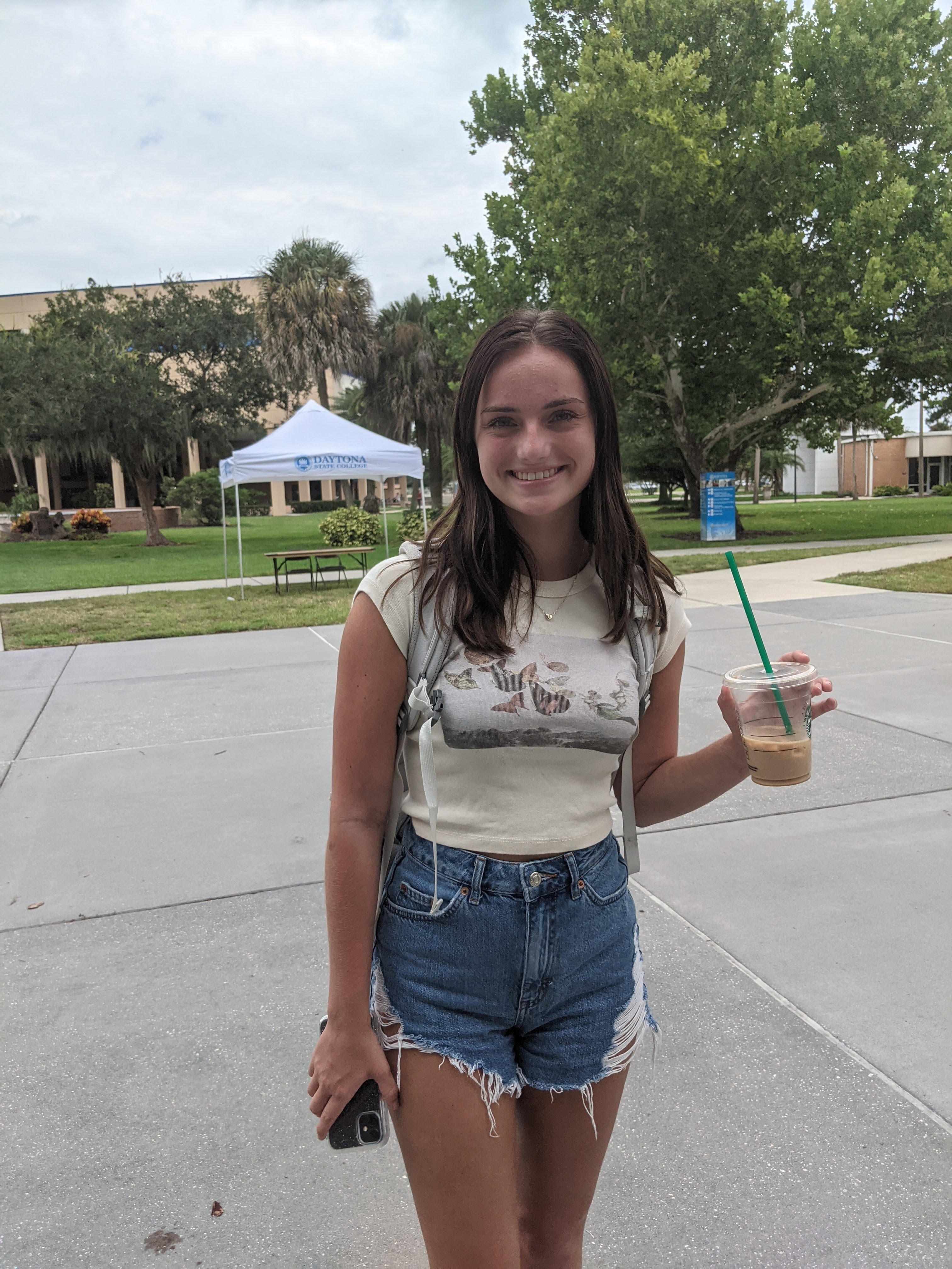 Student enjoying Starbucks on campus