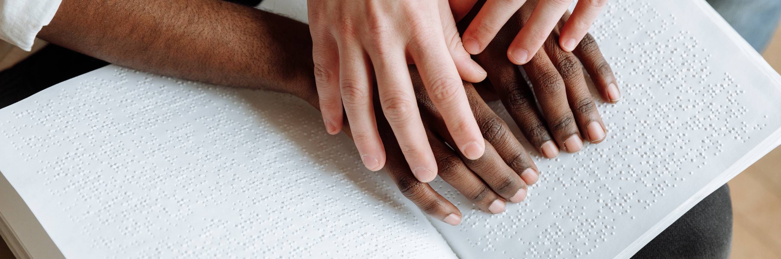 close up of person reading brail 