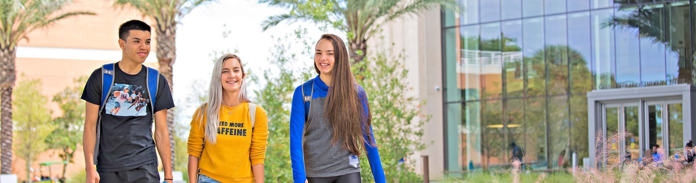 Three students walking to class. 