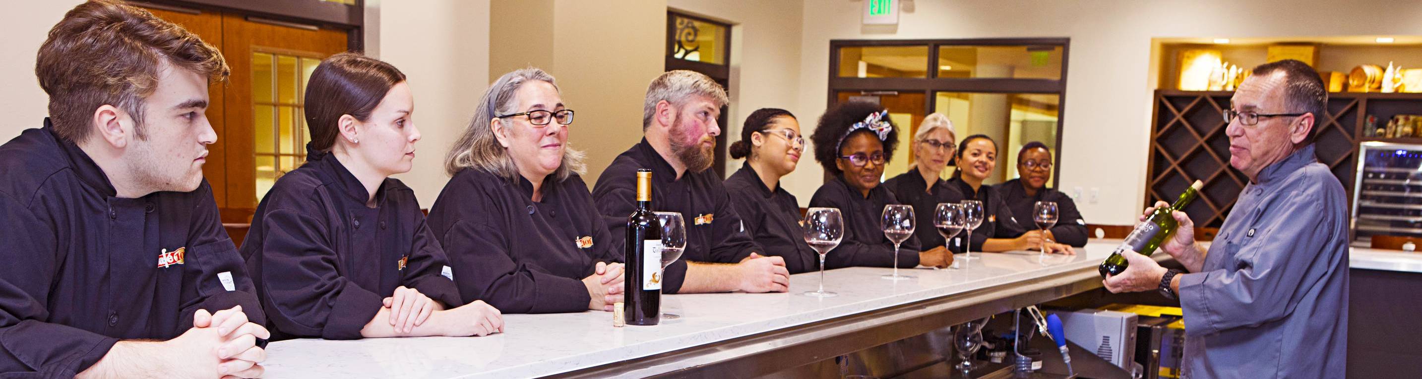 students learning about wine in classroom with teacher