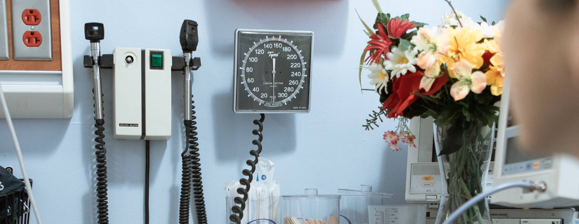 medical monitoring instruments on a blue wall