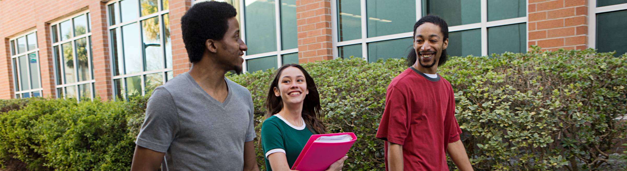 three students walking outside