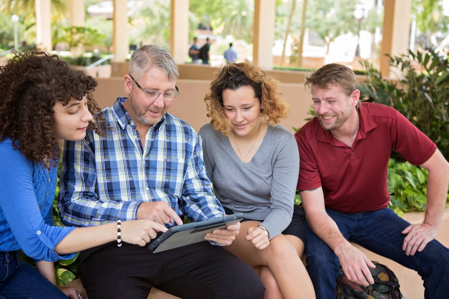 students and family around a laptop