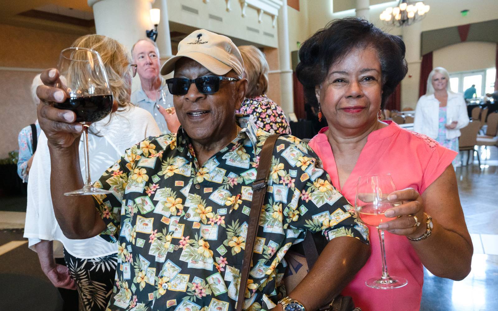 Two event attendees enjoying some wine.