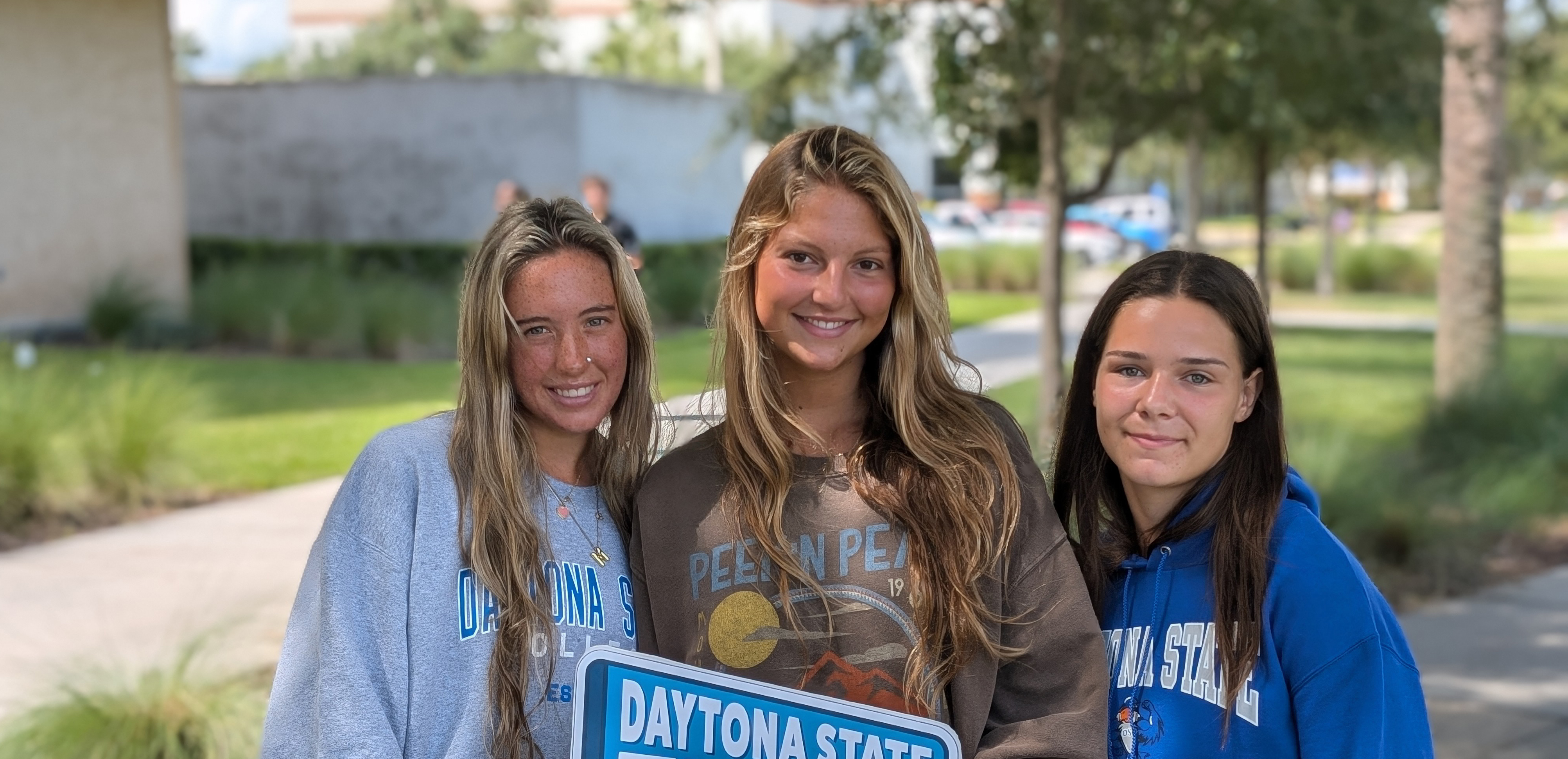 Three students walking to class.